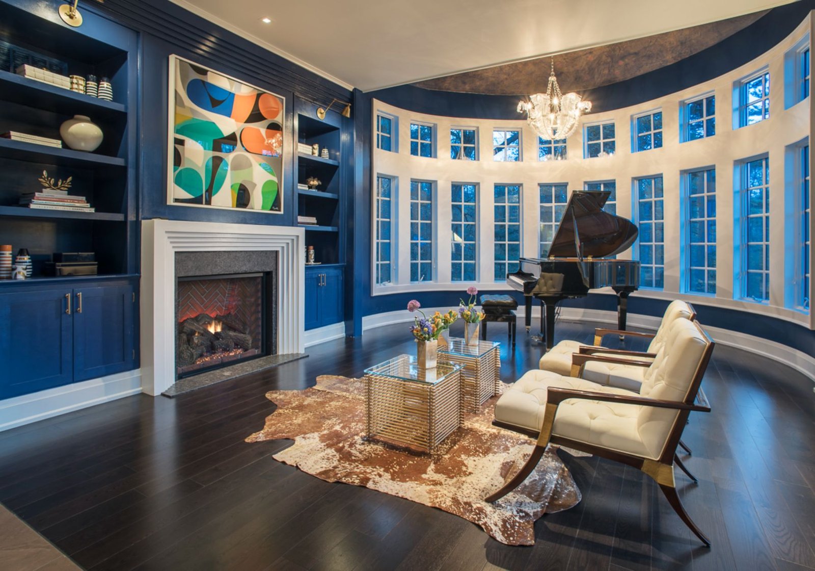 design home studios - custom home builder Wayne pa - blue walls - white accents - dark wood floors - grand piano fireplace