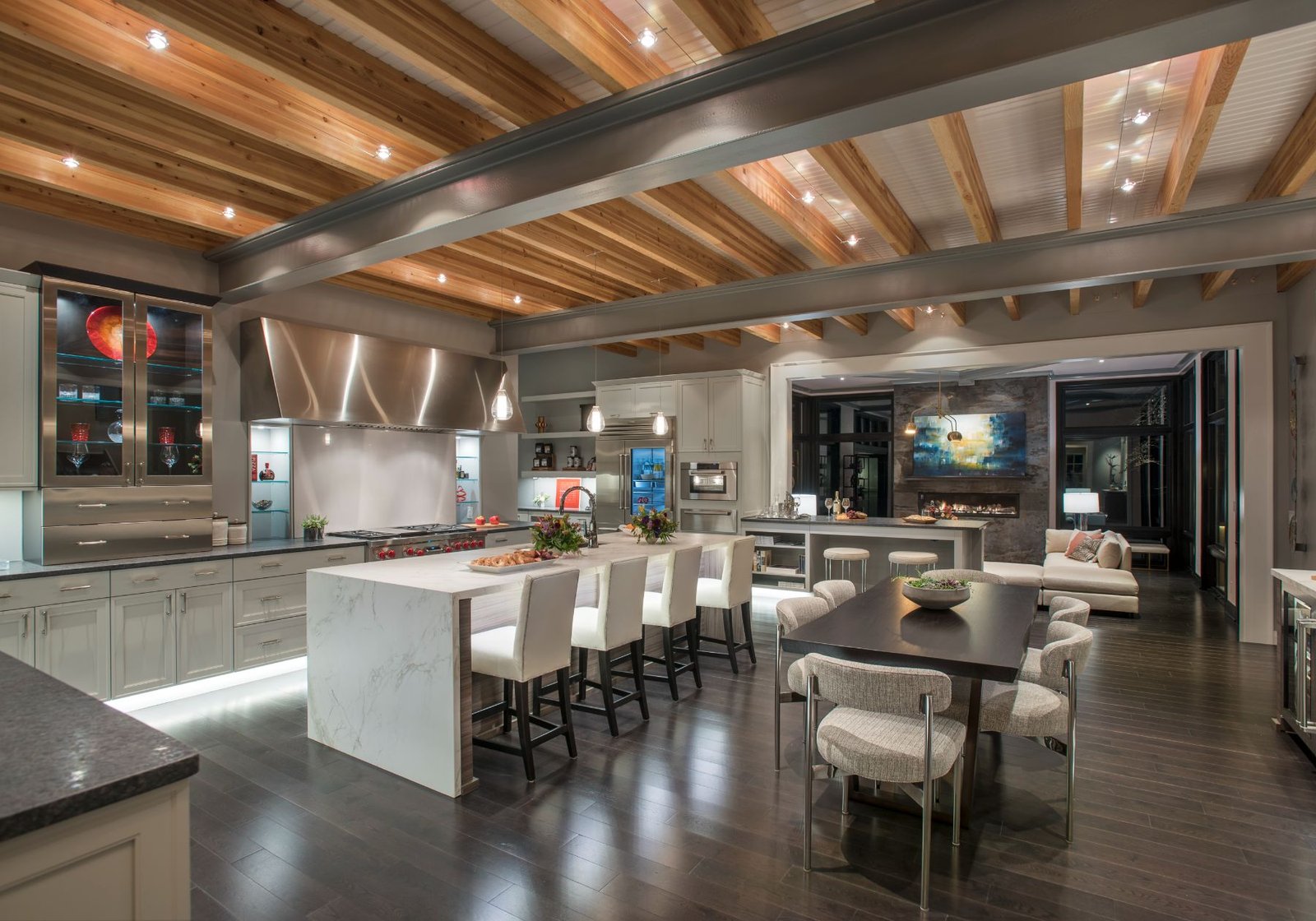 custom home builder Wayne pa - white chairs - grey countertops - underlit cabinets - exposed beams