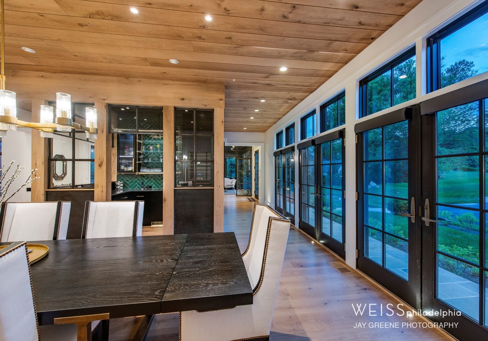 best custom homes wayne pa - design home studios - farmhouse - wooden ceilings - black doors - white dining room chairs