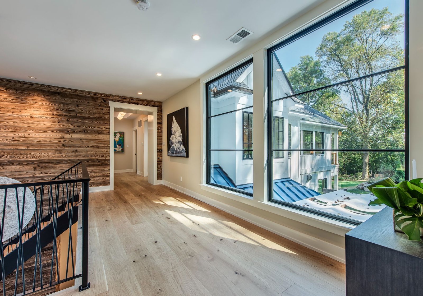 new homes Philadelphia pa - design home studios - hallway - wooden accent wall - large windows