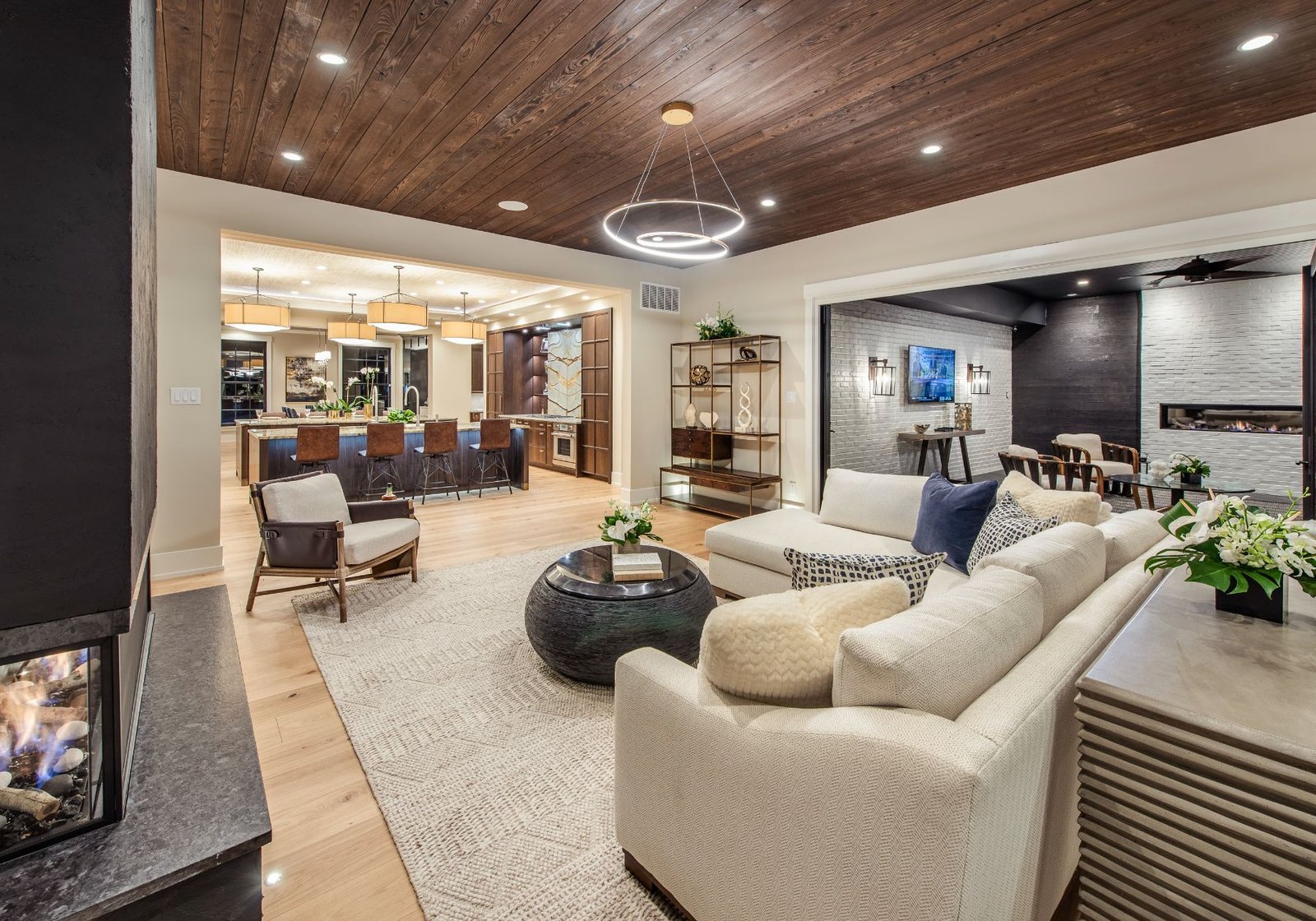 best custom home builder - design home studios - outdoor area - fireplace - wooden ceilings - white furniture