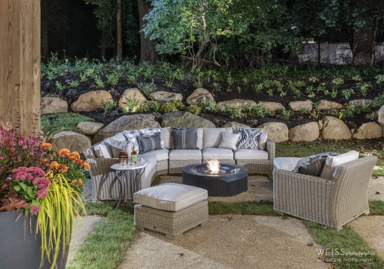 new homes wayne pa - design home studios - modern farmhouse patio area - fireplace - outdoor grey sectional