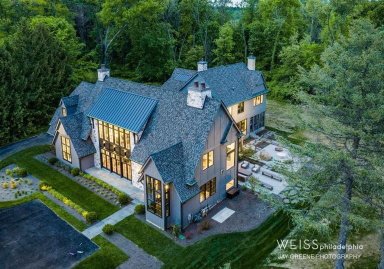 best custom homes wayne pa - design home studios - home exterior - patio area - large windows - grey exterior - aerial shot