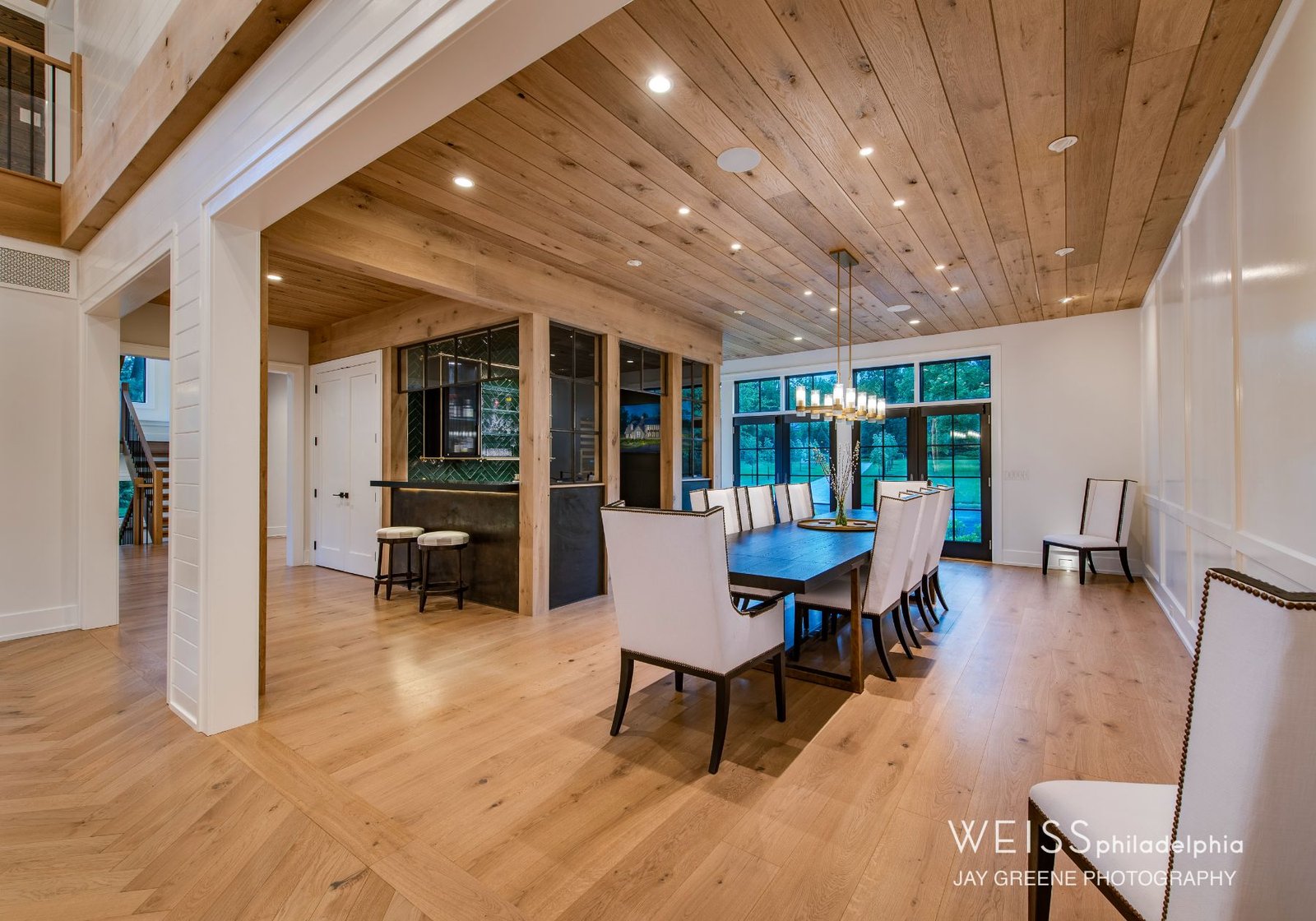 best custom homes wayne pa - design home studios - white dining room chairs - wooden ceiling - white walls