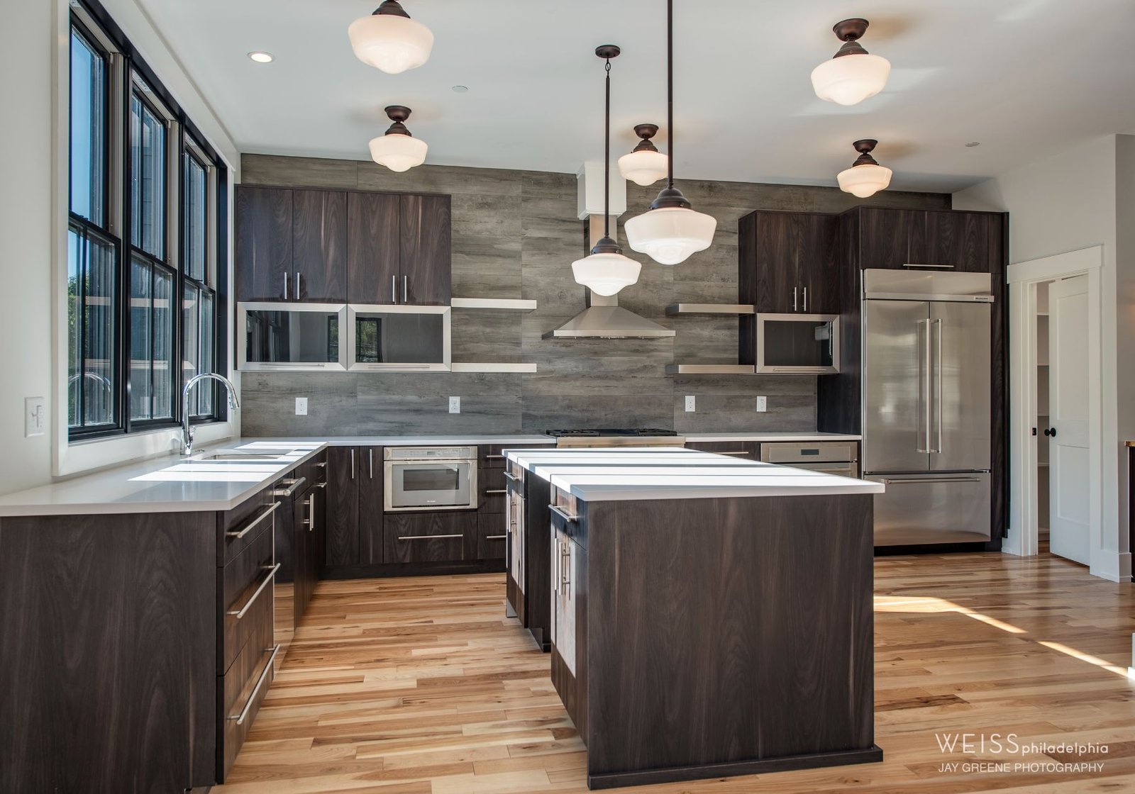 modern Kitchen - stainless steel accents white countertops - design home studios