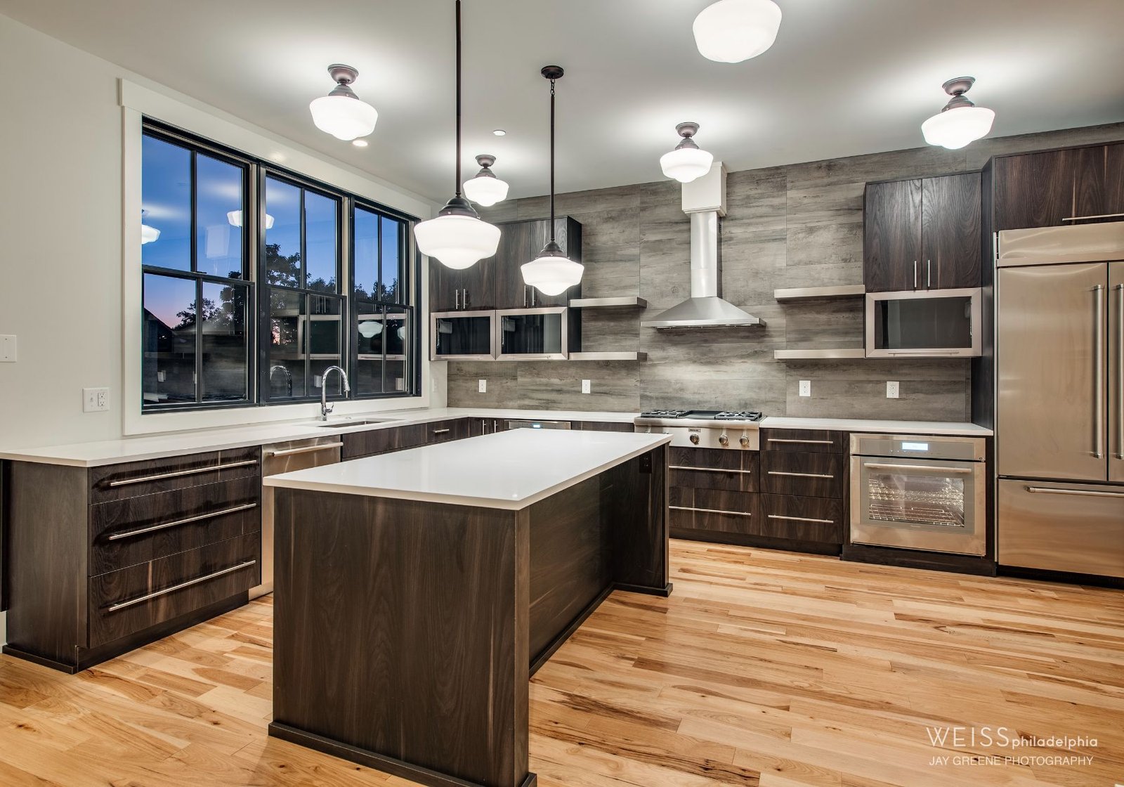 modern Kitchen - stainless steel accents white countertops - design home studios - Philadelphia pa