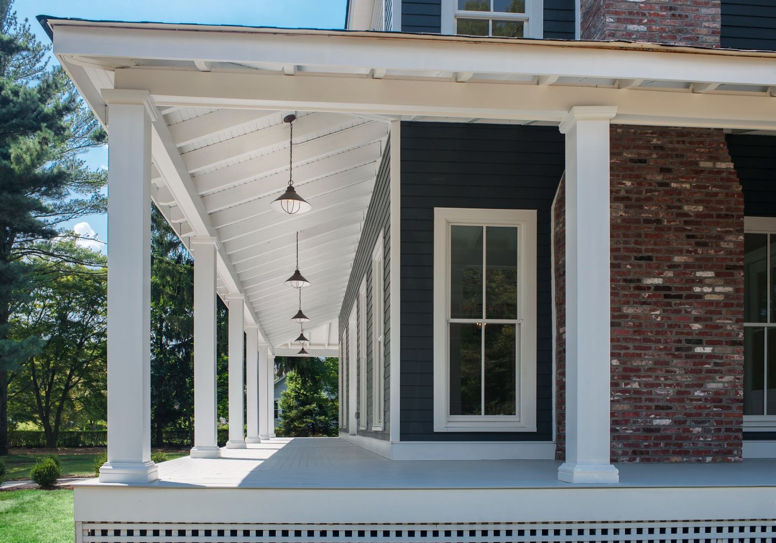 design home studios - best home builder in Wayne pa - wraparound porch blue home