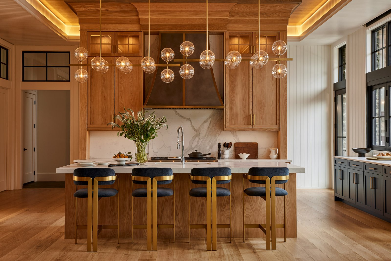 new homes Philadelphia pa - design home studios - custom contemporary kitchen - globe lighting - blue and gold bar chairs - blue cabinetry