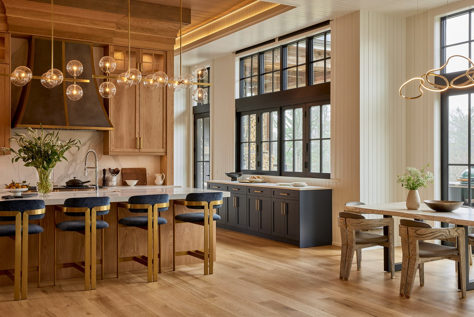 new homes Philadelphia pa - design home studios - custom contemporary kitchen - globe lighting - blue and gold bar chairs - blue cabinetry