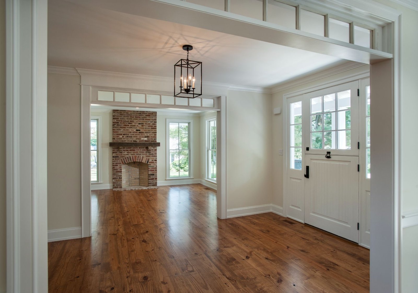 Red Fox Living Room - custom home builder in Philadelphia pa - design home studios - wood floors - white doors - fireplace
