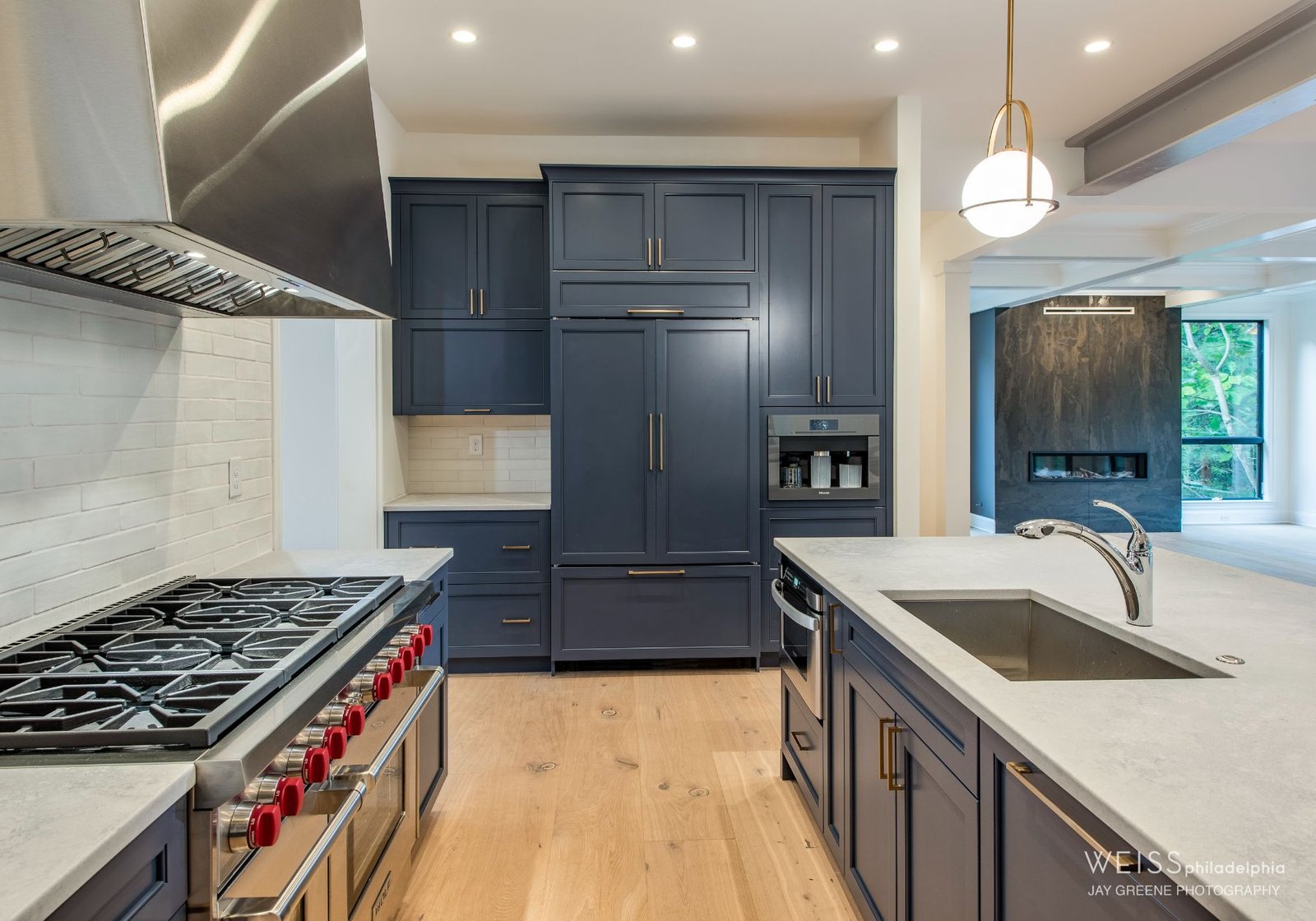 425 custom kitchen - blue cabinets - stainless steel appliances - white details