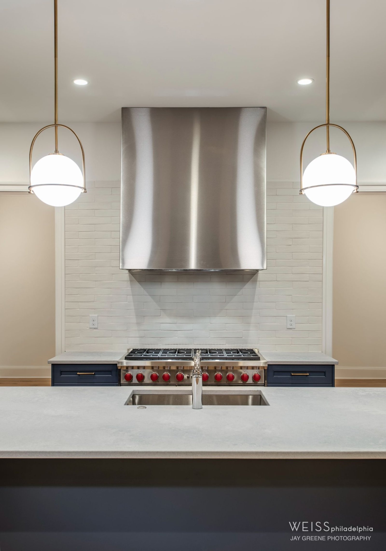 syd 425 - custom home builder Wayne pa - kitchen - globe lights - blue cabinets - white countertops