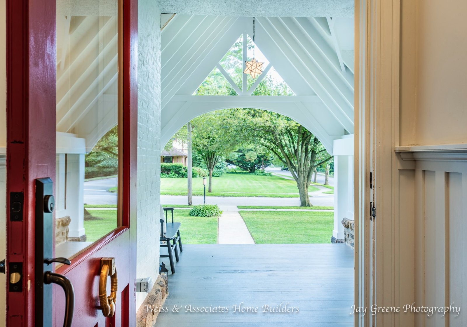 midland road - home entrance - red door - white a frame archway - design home studios